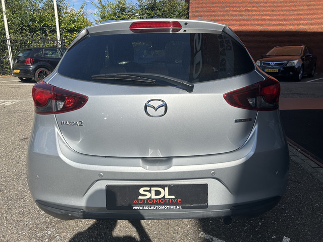 Mazda 2 1.5 Skyactiv-G Comfort    NAVI + CARPLAY    PDC    CRUISE    AIRCO    STOELVERWARMING