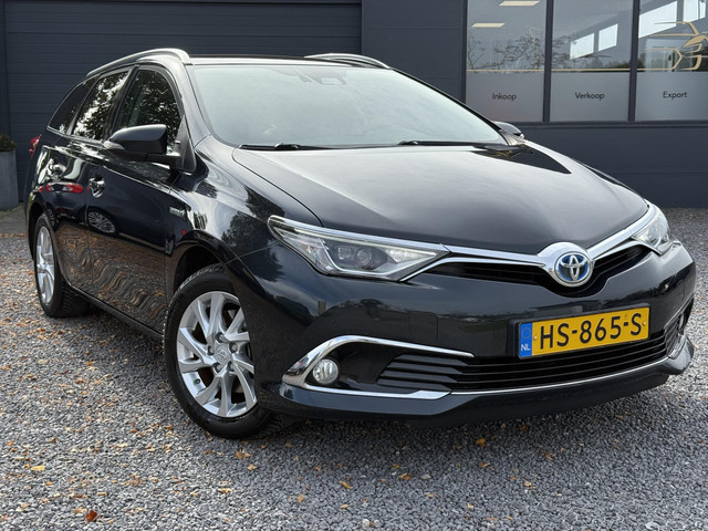 toyota-auris-touring-sports-1.8-hybrid-lease-pro-2e-eigenaar-pano-navi-camera-stoelverwarming-clima-cruise-halfleder-lm-velgen-pdc-v-a-apk-to